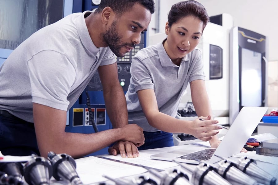 engineers looking at laptop