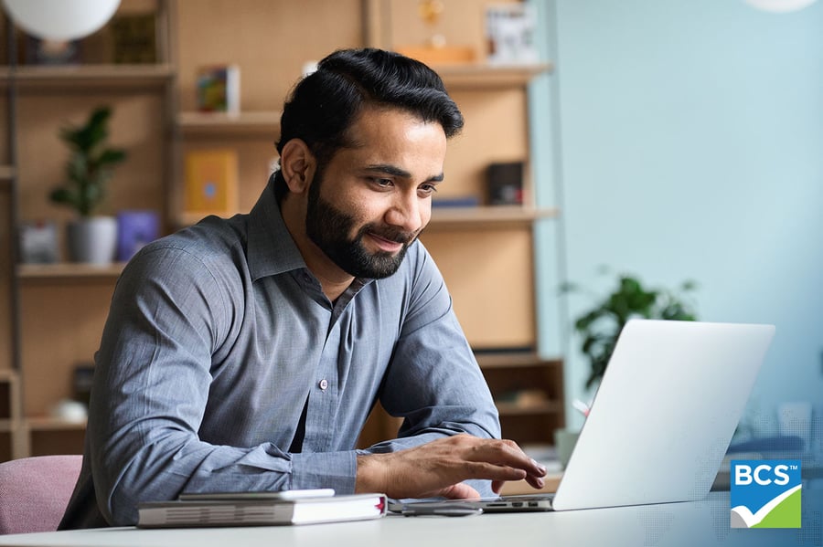 man using laptop at desk